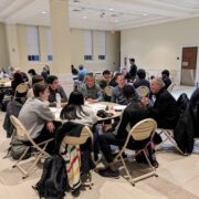 Forum participants deliberate at round tables