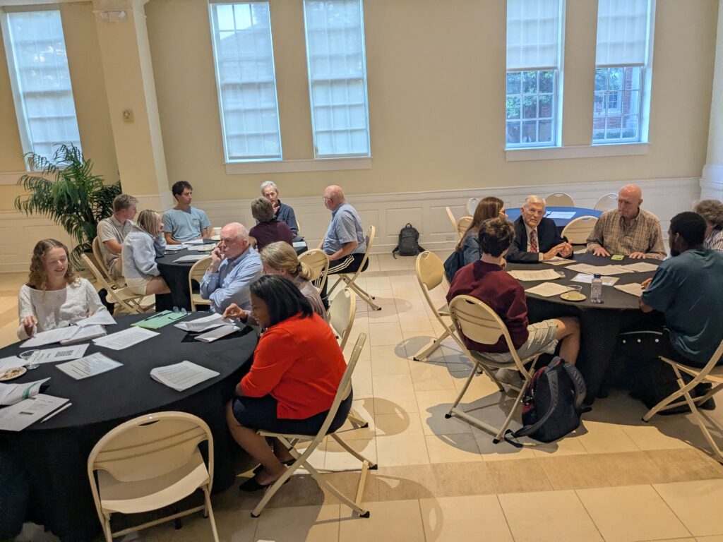 Three tables of deliberators.