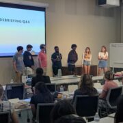 Photo of senior fellows answering questions at training