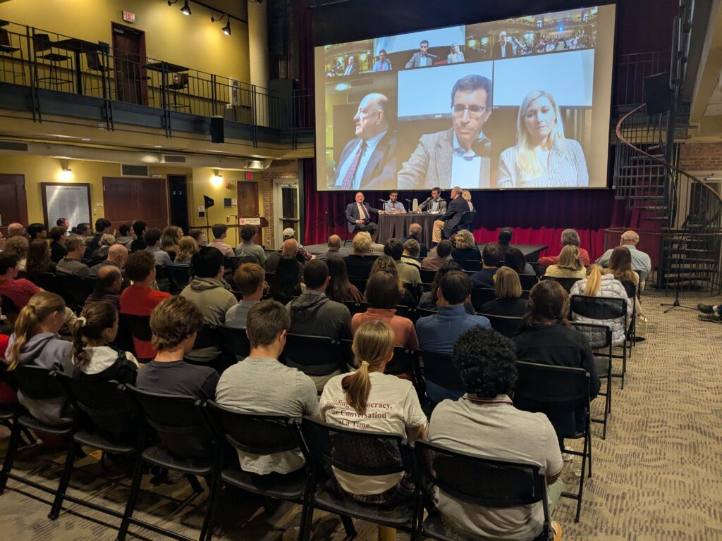 image of audience with roundtable in the background
