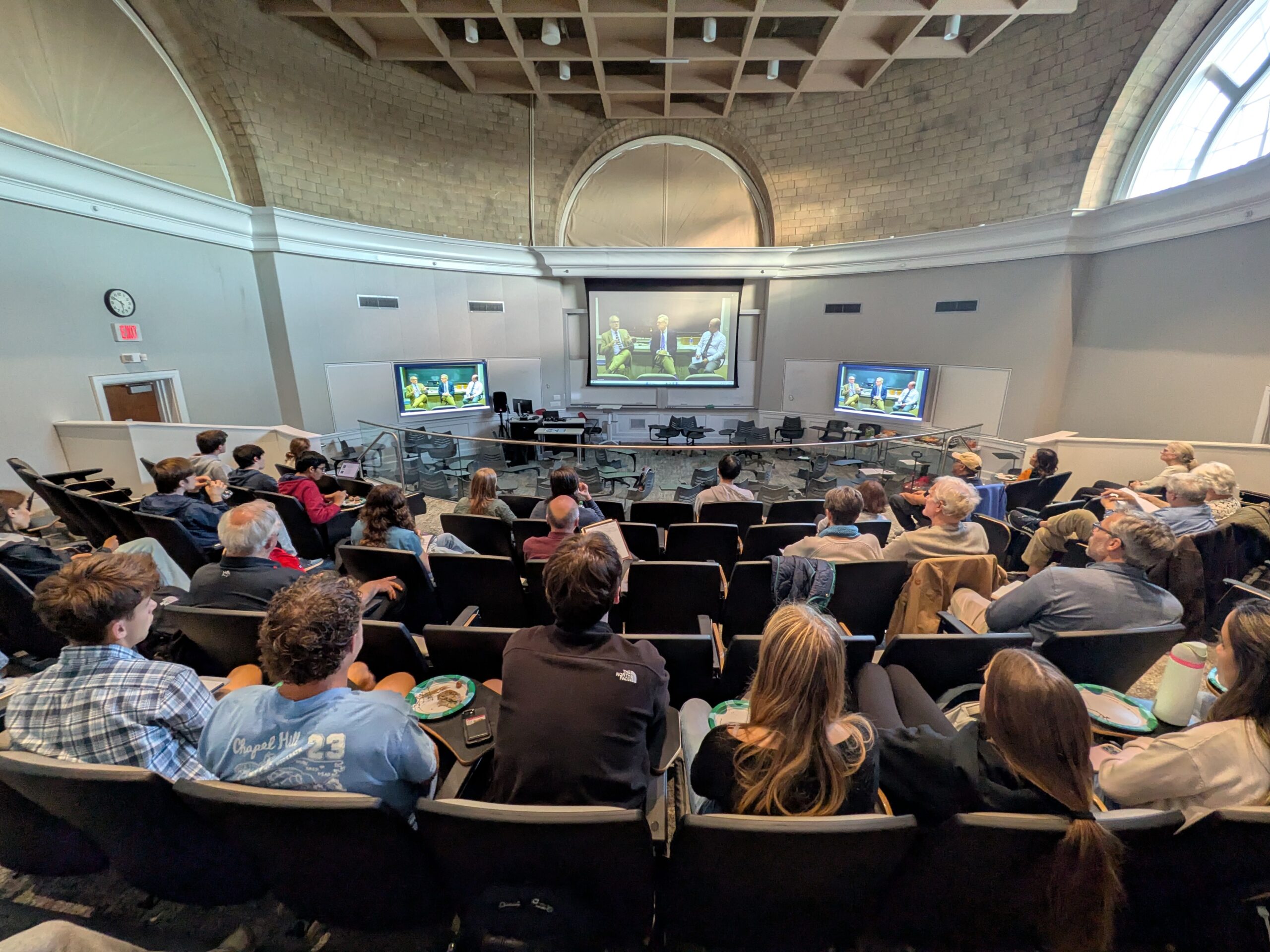 Photo of audience watching screens at Watch Party