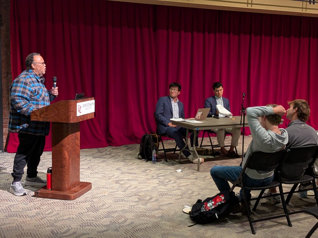 Photo of Dan Aldridge speaking to the audience